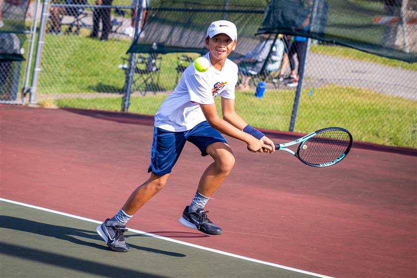 Students play tennis